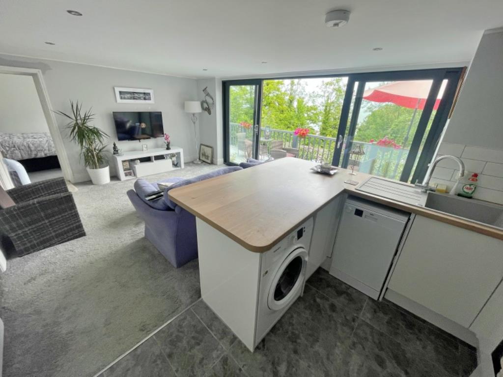 Lot: 74 - HOLIDAY COTTAGE WITH SEA VIEWS - Kitchen and living room holiday cottage in Ocean View Road Ventnor